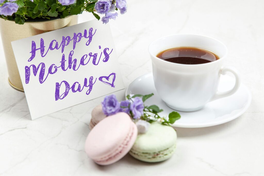 Celebrate Mother's Day with a heartfelt card, coffee, and macarons for a lovely morning gift.
